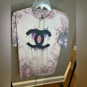 Boutique style Chanel T-shirt with tags, never worn, size M.